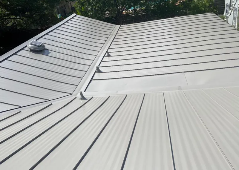 Solar attic fan installed on a metal roof for Roof Ventilation in Waipahu
